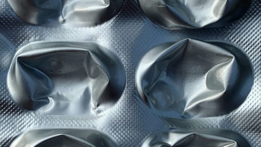 a close up of a metal pan filled with food